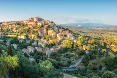 French medieval town in Provence - Gordes. Beautiful panoramic view on medieval town Gordes in sunset light.